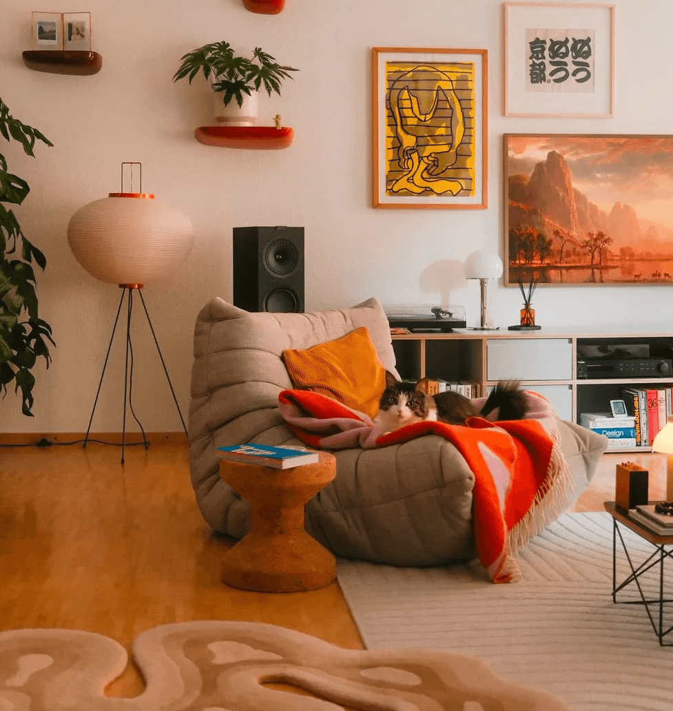 Cozy Soho Living interior with a bean-bag sofa and warm lamp light